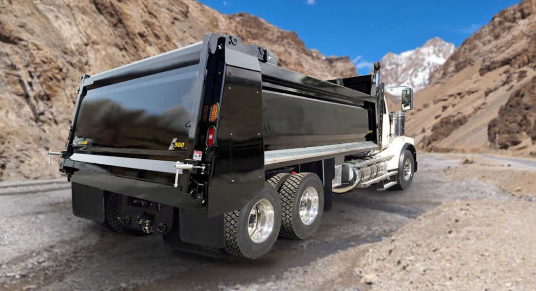 NeuStar Smooth Side-Wall gravel box mounted on a tandem dump truck chassis